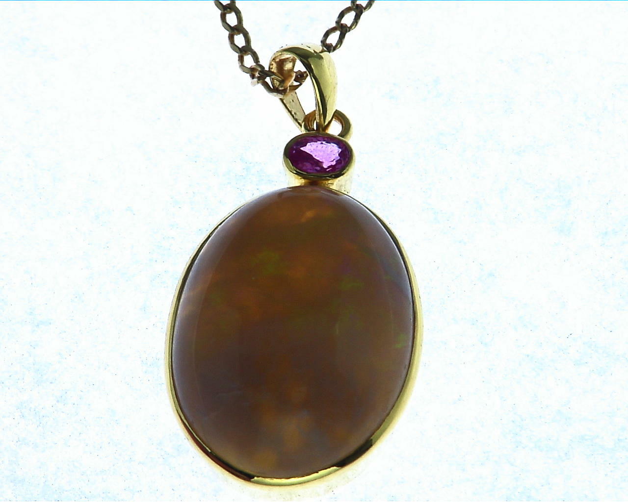 Opal (Australian) Natural Genuine Gemstone Set In 14 kt Yellow Gold With A Genuine Pink Sapphire Pendent